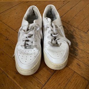 White Nike Air Force tennis shoes